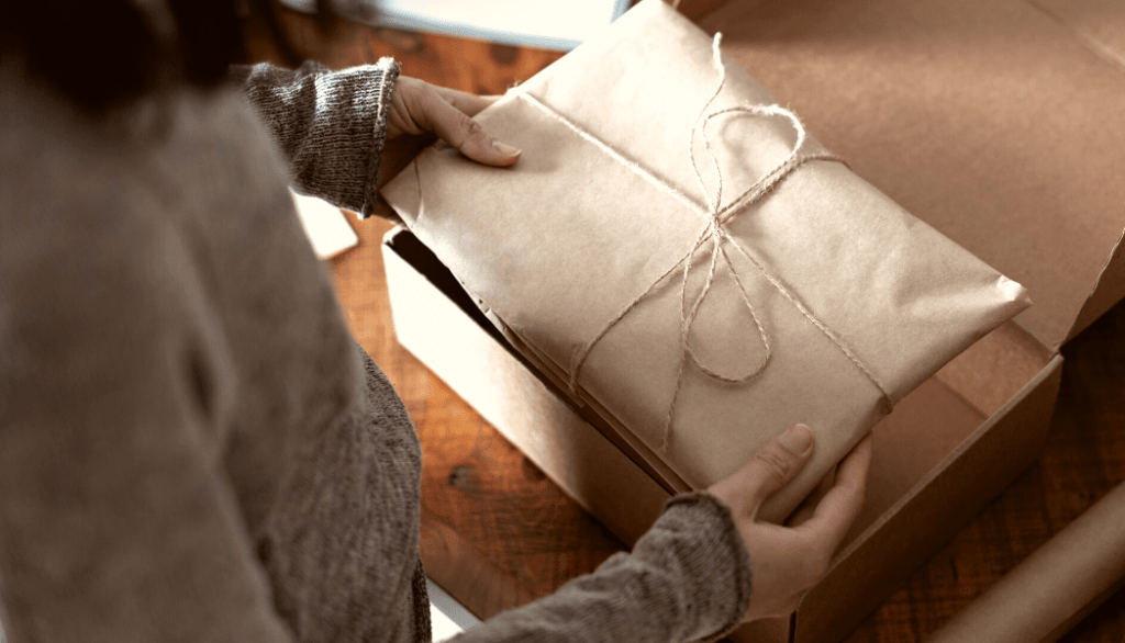 The Importance of Fulfillment Services in Subscription Boxes  - Woman packing